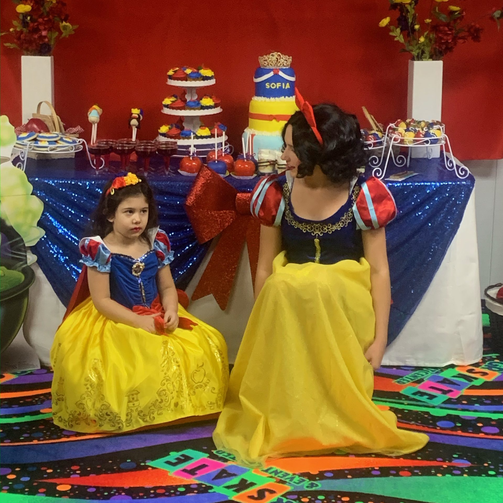 a group of colorful vases sitting on top of a bed