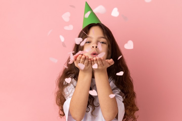 a young girl holding an umbrella