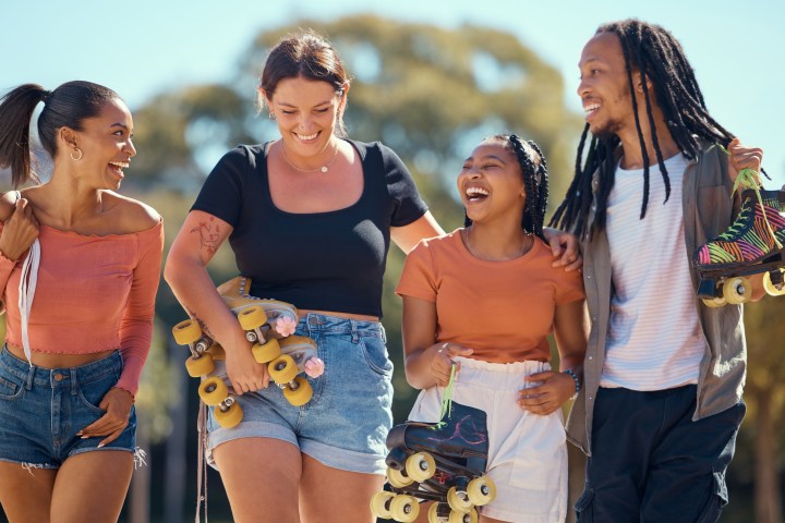 a group of people standing next to a woman