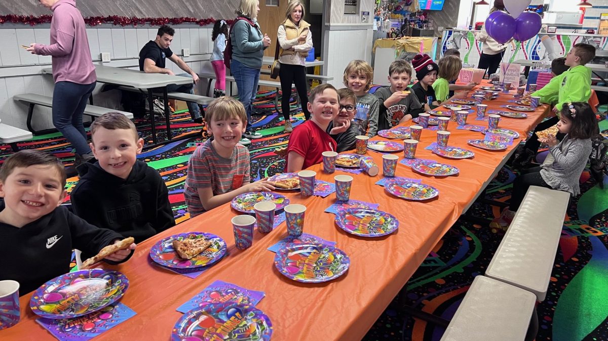 a group of people sitting at a table